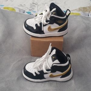 Jorden 1 Black, White, and Gold